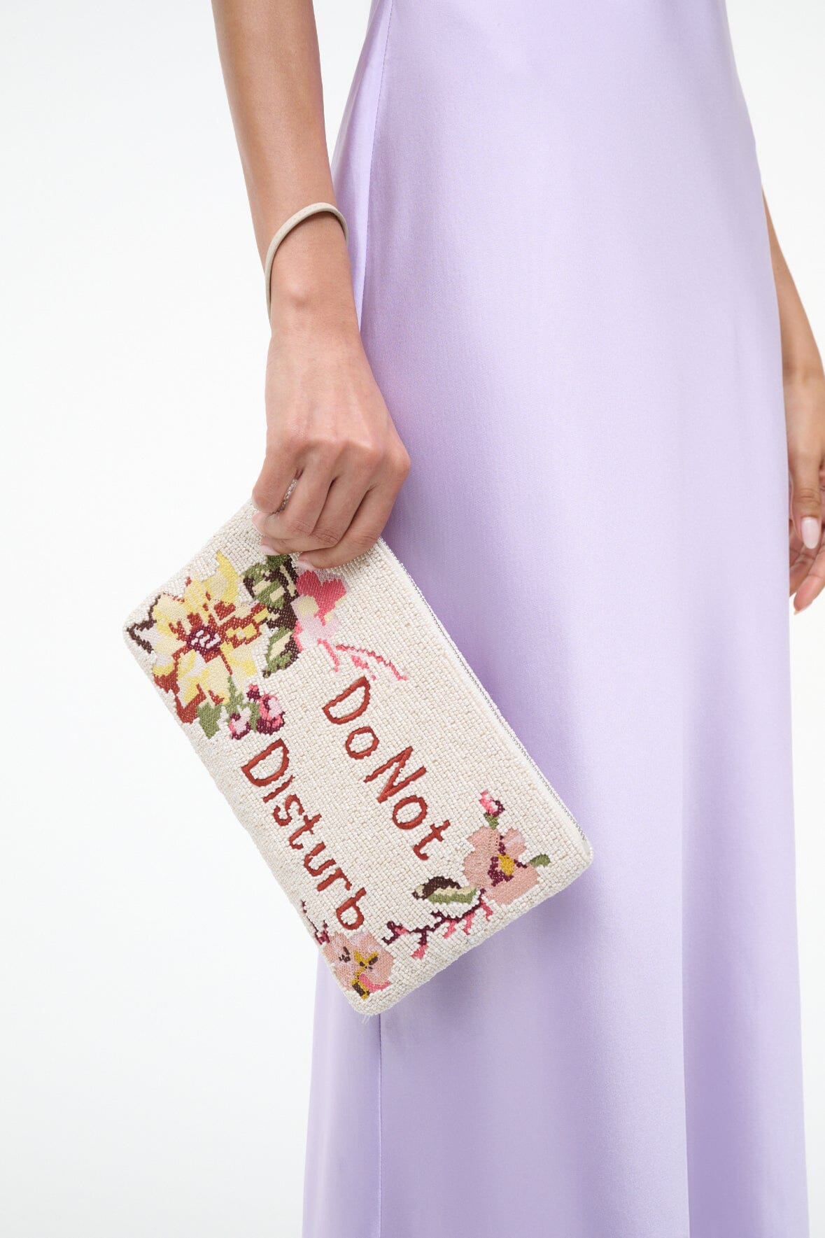 Beaded pouch with “Do Not Disturb” lettering and floral pattern, wrist handle