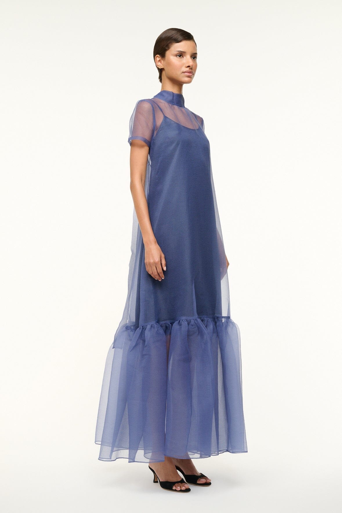 Navy organza-style dress with high neck, short sleeves, and ruffled tulle skirt