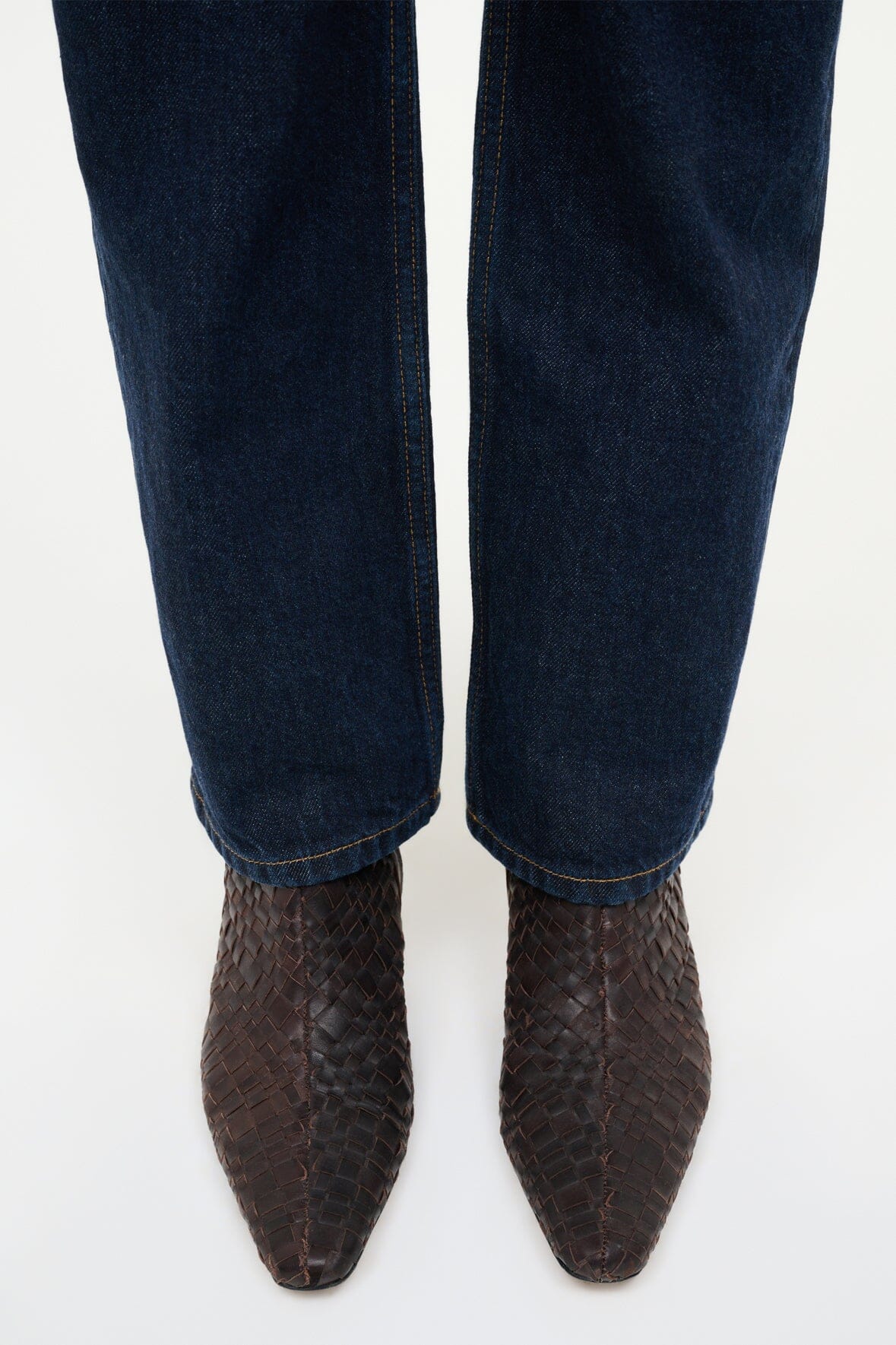 Pair of dark espresso woven leather ankle boots, pointed toe and stacked heel