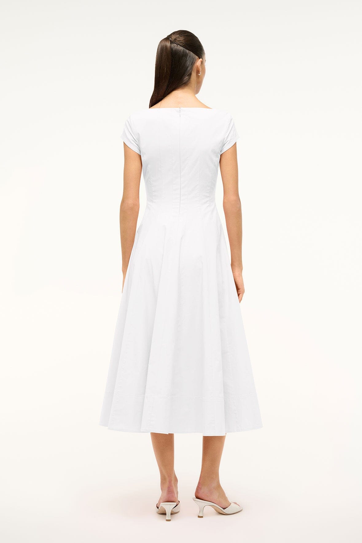 White short-sleeve midi dress from back view with flared skirt