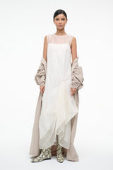 VIOLA ivory sleeveless dress with flowing layered skirt and draped side panels