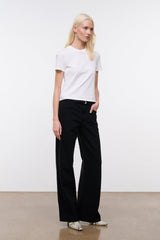 Black relaxed jeans with wide leg, button-and-zip front, belt loops, and pockets