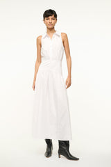 White sleeveless shirt dress with collared neckline and tiered midi skirt
