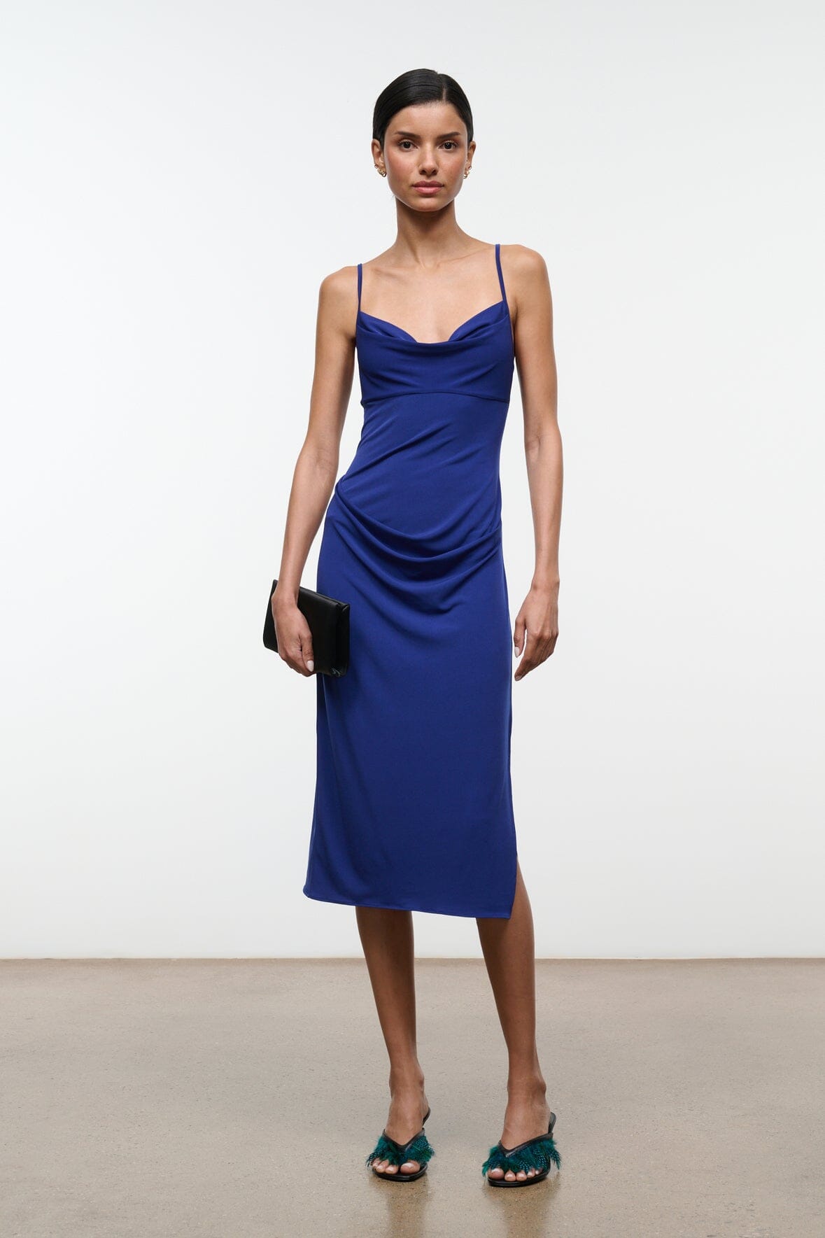 Midnight blue ruched midi dress with cowl neckline and thin spaghetti straps