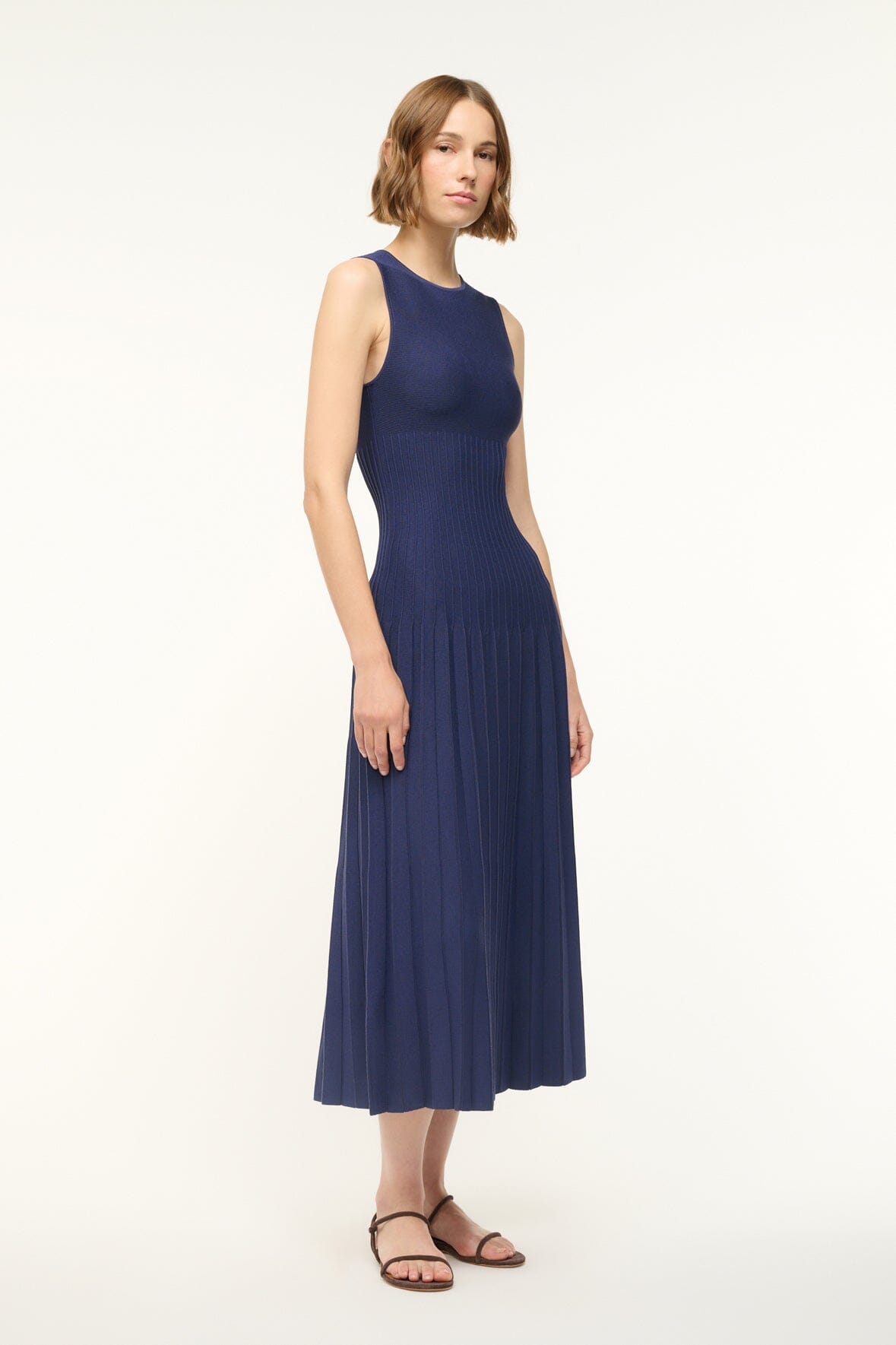ELYSE navy sleeveless midi dress with straight fit bodice and pleated hem