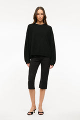 Black cropped pants with relaxed slim fit and mid-calf hem