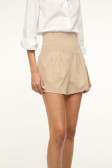 Women’s stone-tan shorts with pleated front and cuffed hem