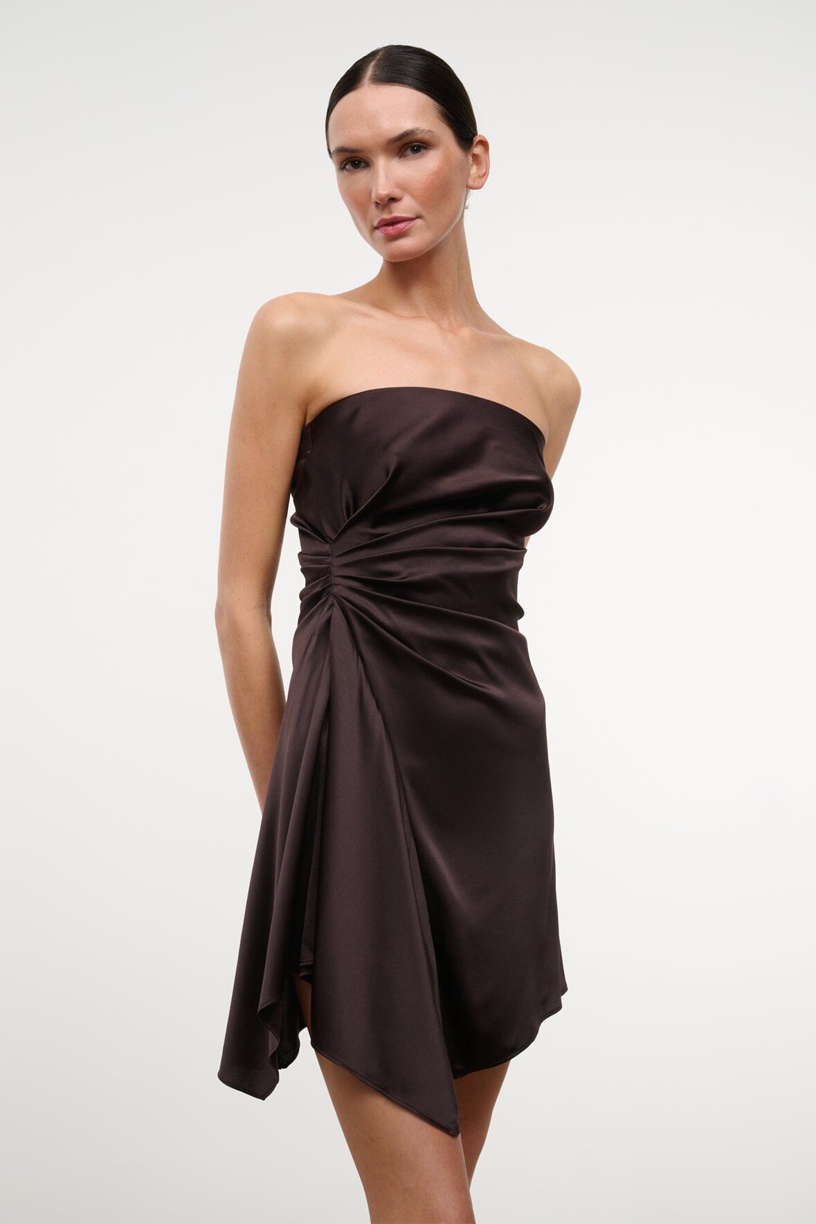 Strapless ruched satin mini dress in dark brown with knotted drape at waist