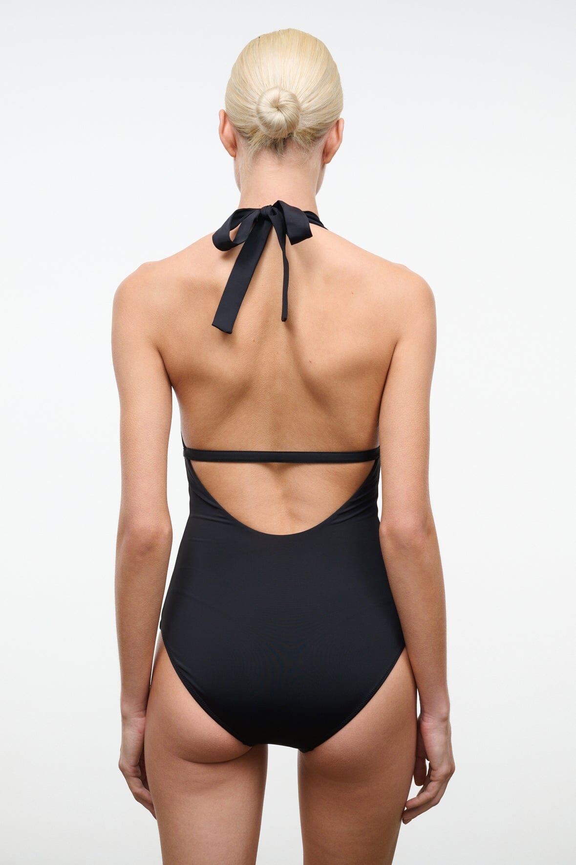 Black one-piece swimsuit back view with tie bow and crossing straps
