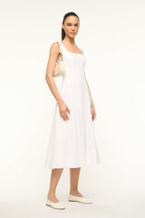 Cream shoulder hobo bag with gold hardware, worn by model at side