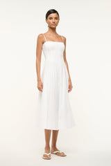 White midi dress with thin straps and softly pleated flared skirt