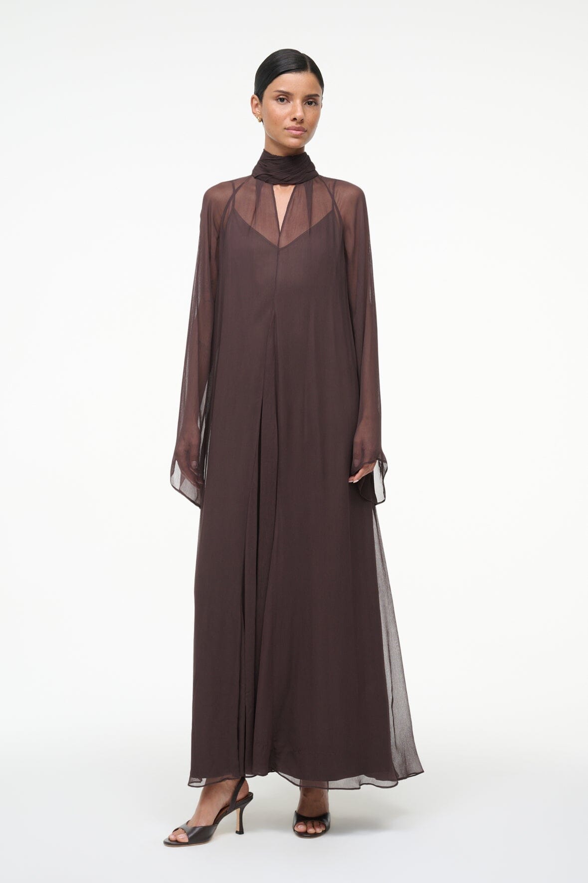 Brown high-neck maxi dress with sheer sleeve overlay and loose, straight fit