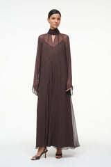 Brown high-neck maxi dress with sheer sleeve overlay and loose, straight fit