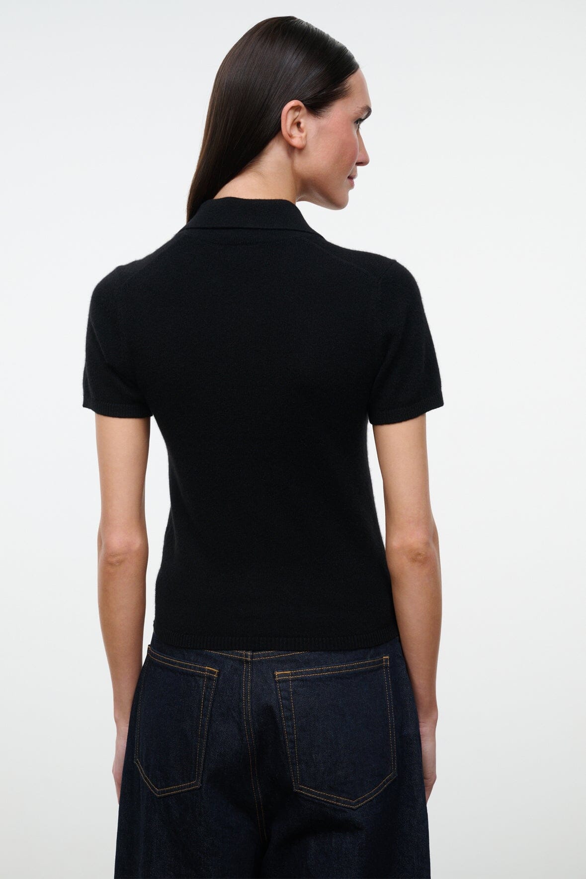 Black GINO cashmere polo sweater, back view, short sleeves and ribbed collar