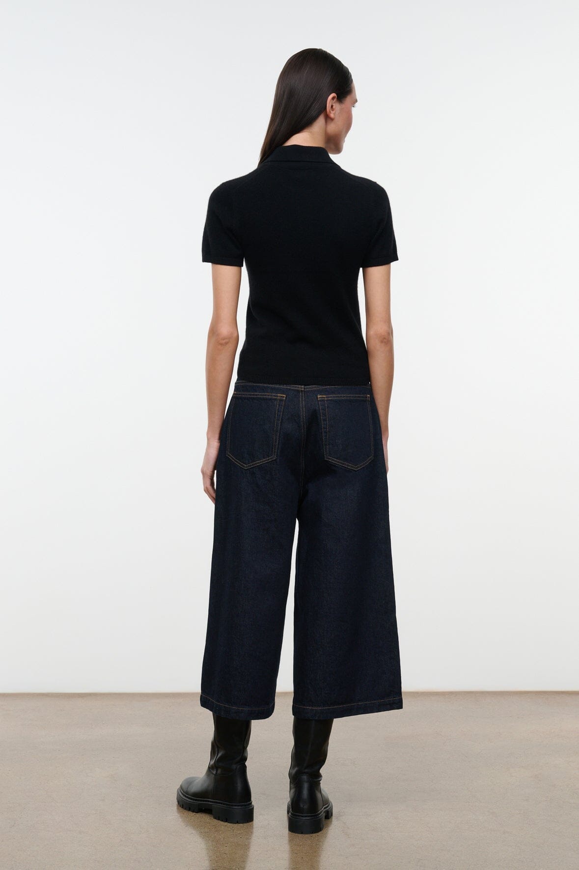 Hunter indigo denim culotte jeans, back view with wide cuffed hem and patch pockets