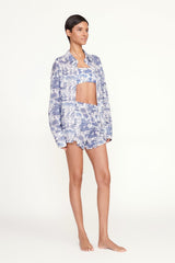 Blue and white toile high-waist shorts with ruffled hem