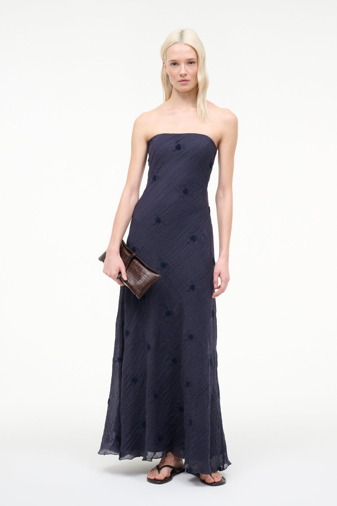 Dark navy strapless maxi dress with scattered dots and smooth, straight silhouette