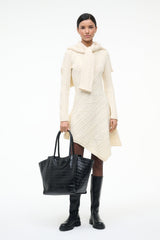 Black croc-effect leather tote bag with double handles and roomy open interior.