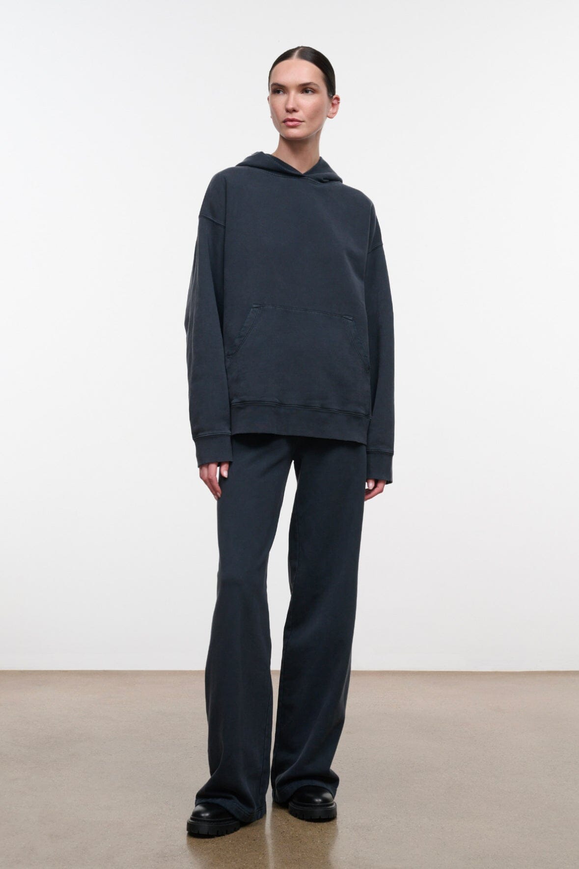 Washed black terry pants with elastic waistband and wide straight legs