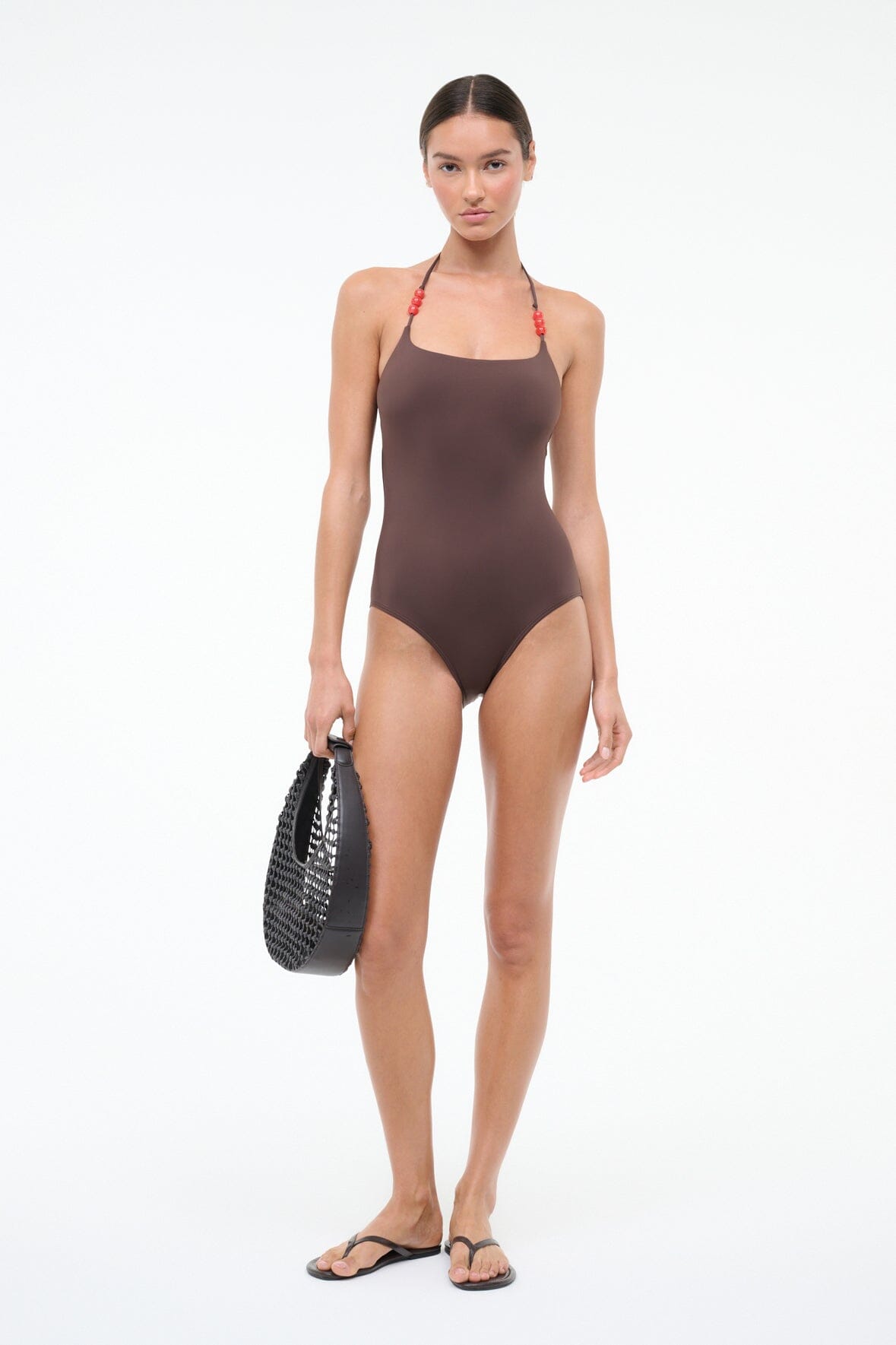 Dark brown halter one-piece swimsuit with halter back tie and red beaded straps