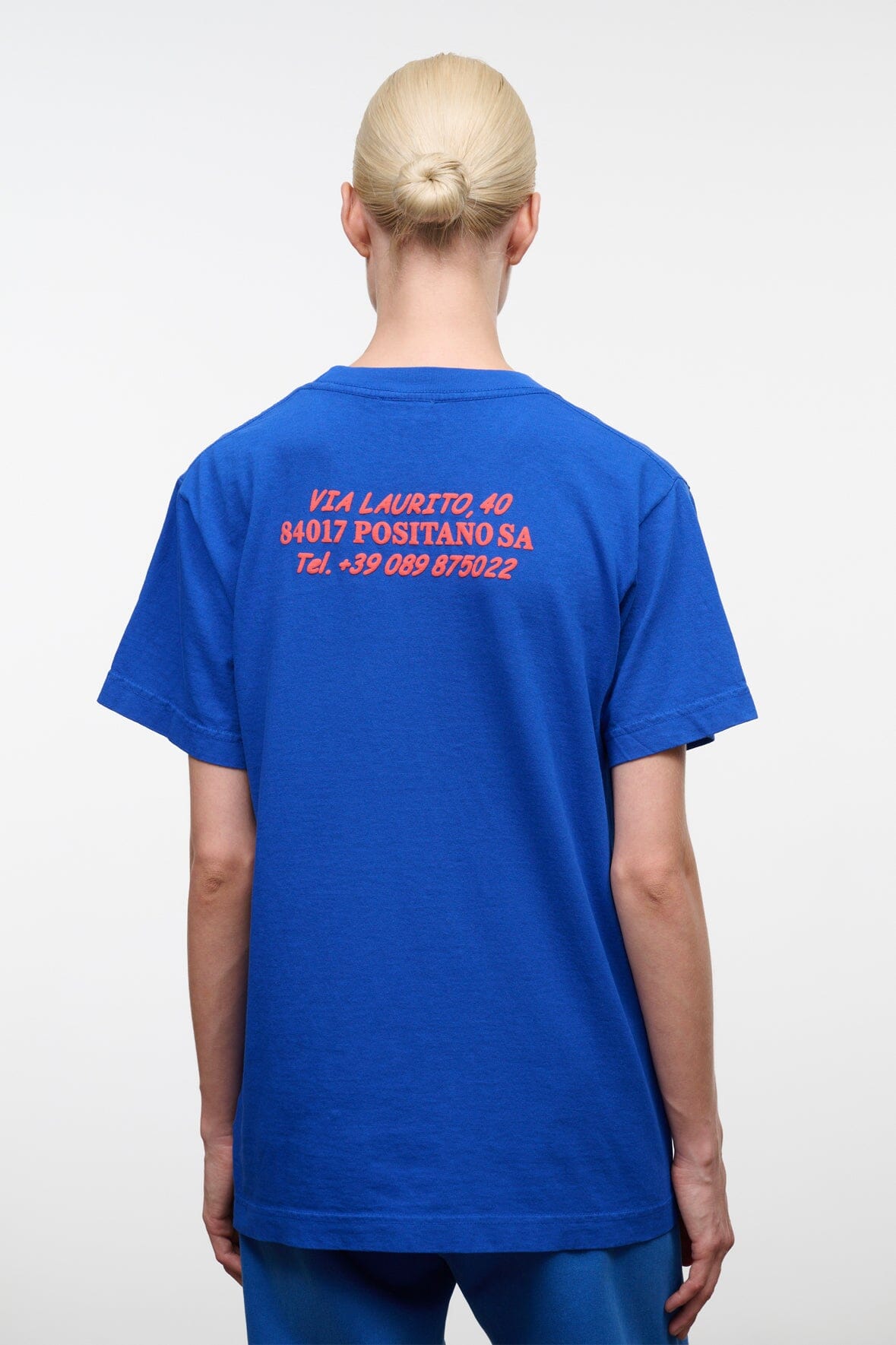 Blue crew-neck T-shirt with back print text and centered graphic