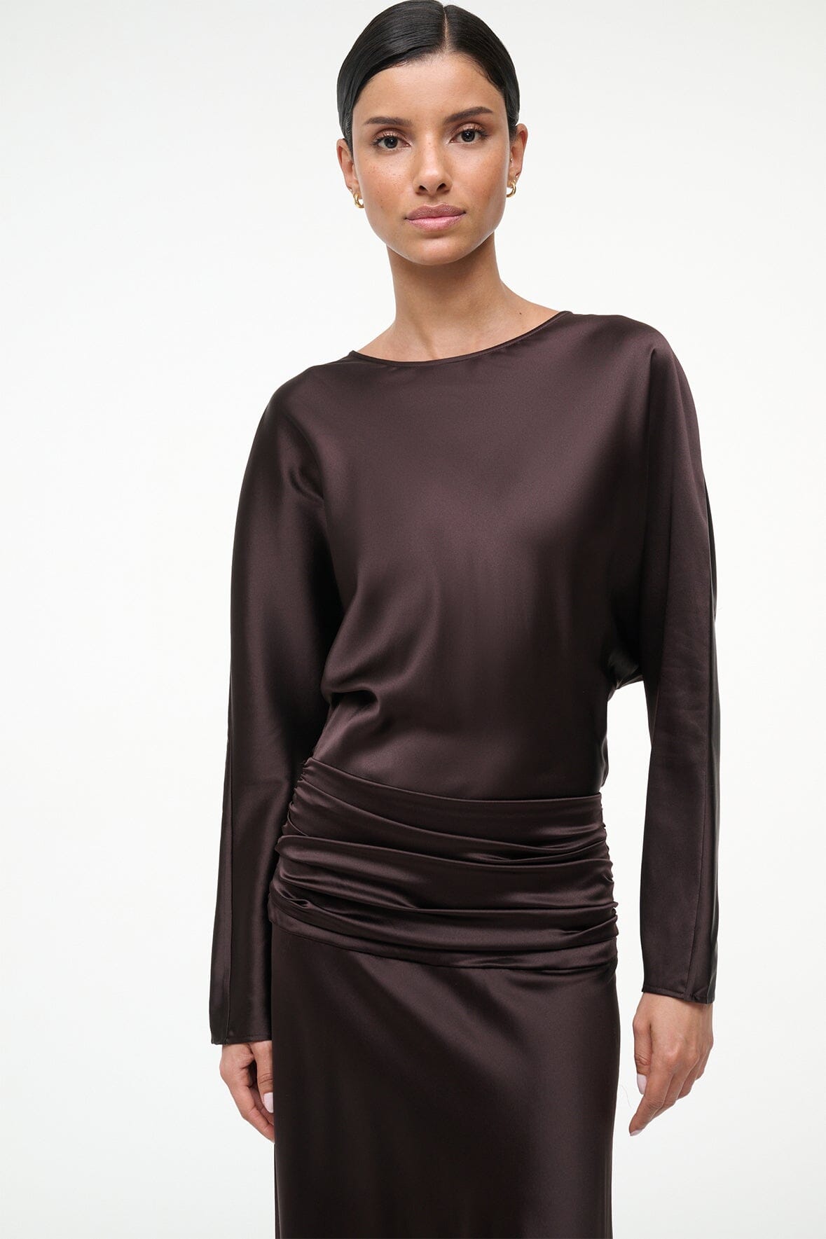 Silk dress portrait view: dark brown long sleeves, boat neckline, ruched waist detail.