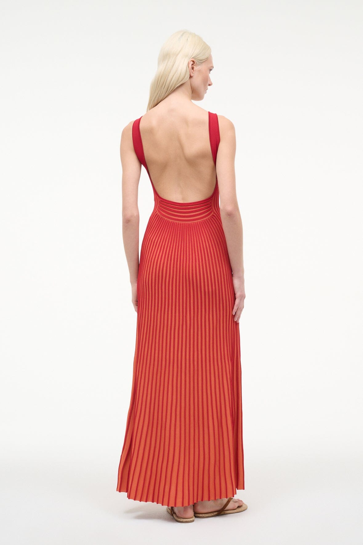 Red sleeveless maxi dress with V-back and vertical stripe pleated fabric
