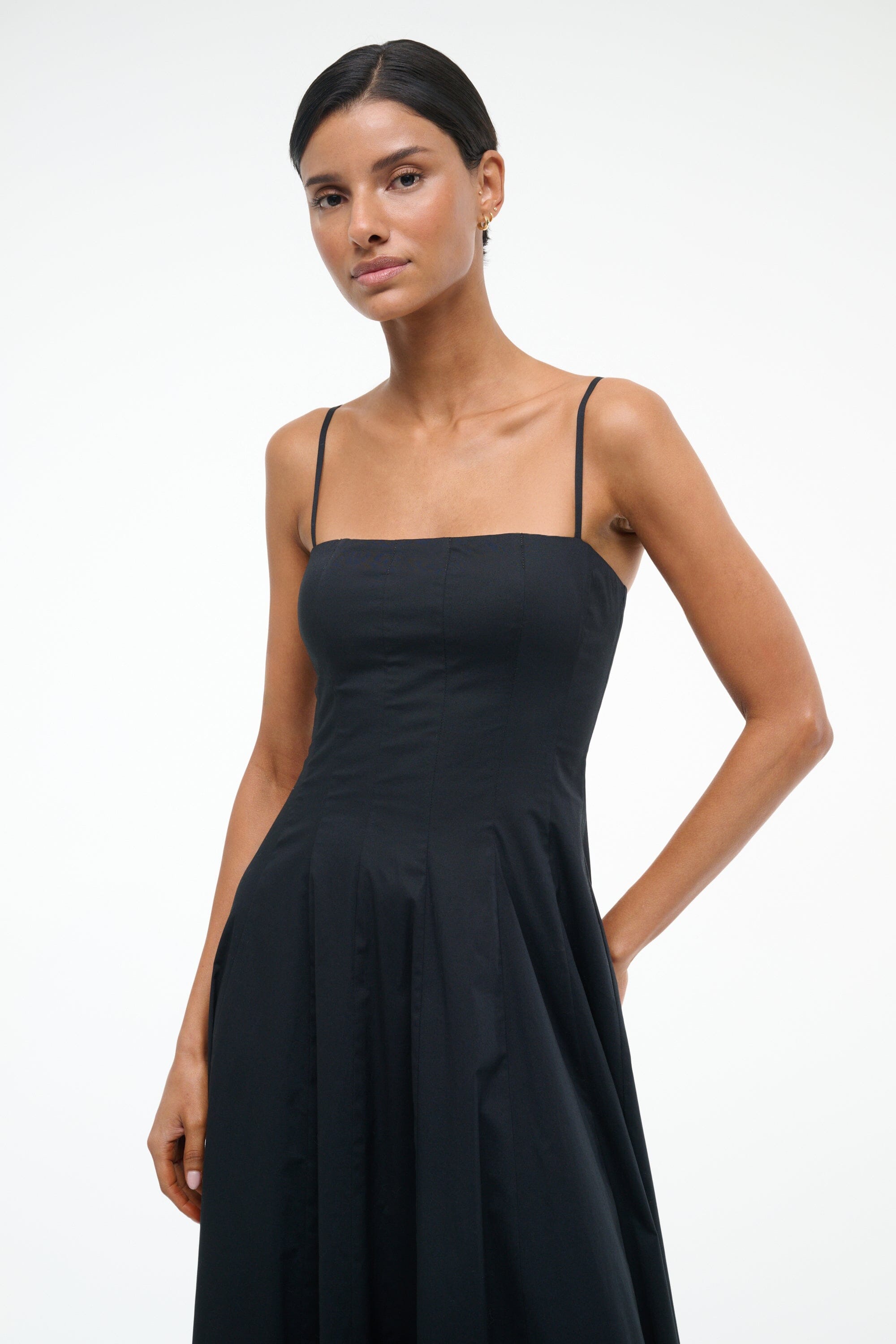 Black maxi dress front view with spaghetti straps and pleated waist