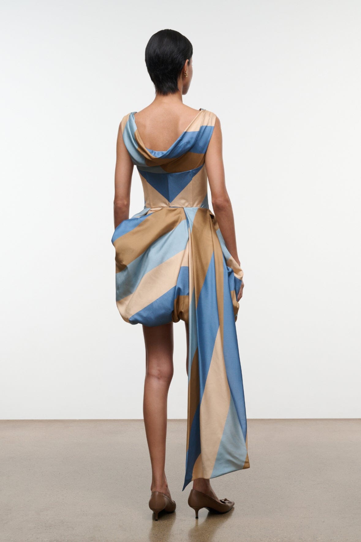 Silk mini dress in desert stripe print, V-back and draped wrap skirt, sleeveless