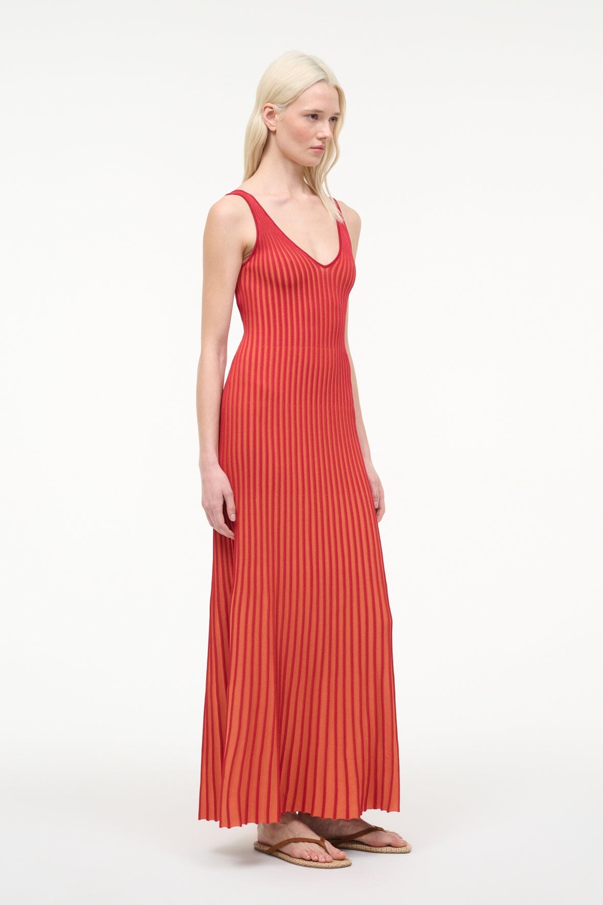 Red pleated sleeveless maxi dress with V-neck and vertical stripe texture