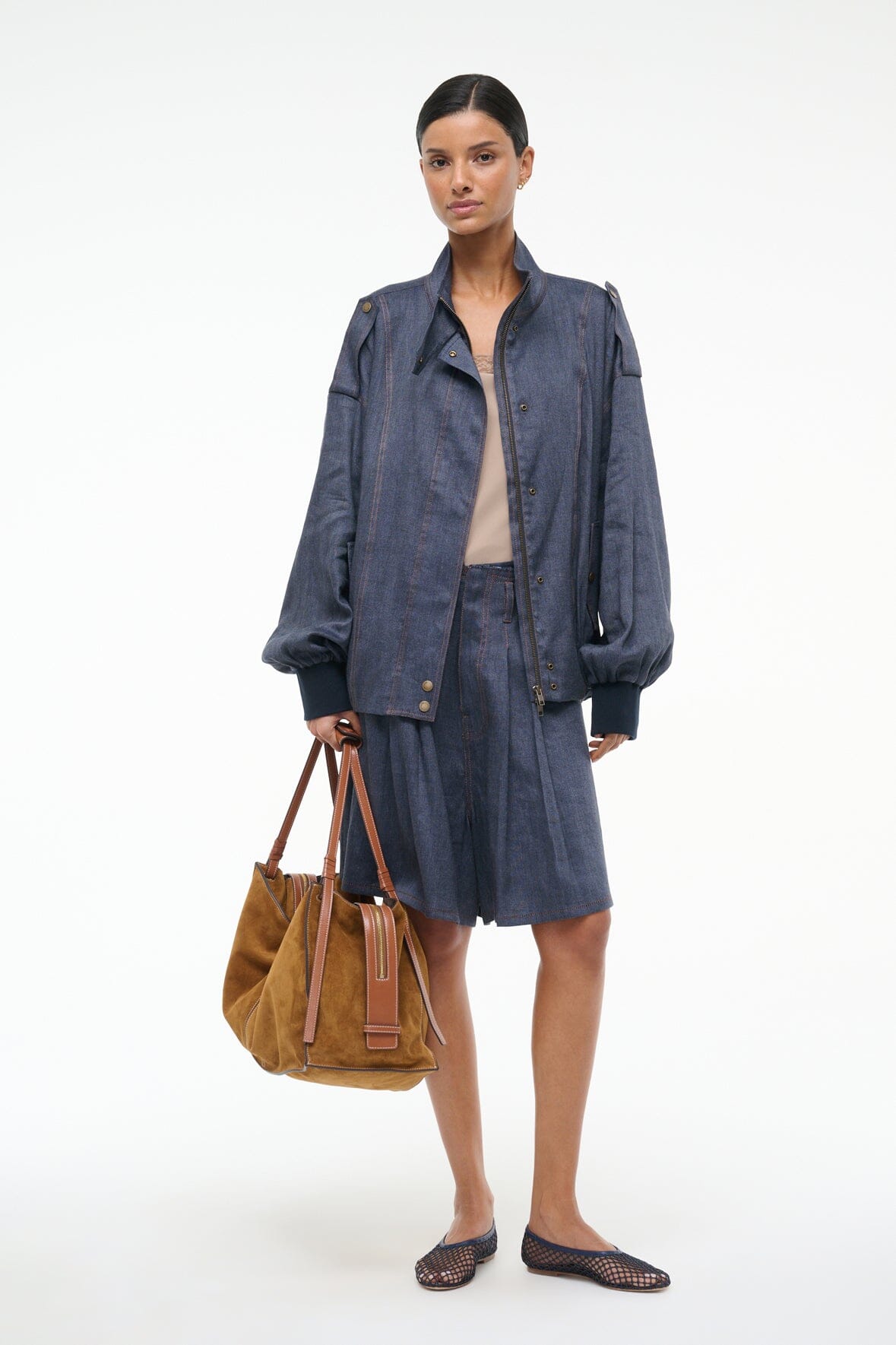 Women’s chambray jacket in dark blue with snap buttons, collar, and patch pockets
