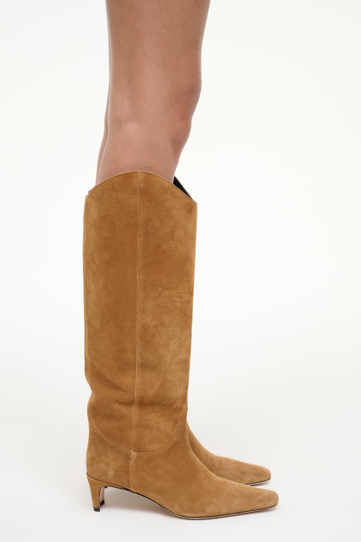 Tan suede tall western boot with pointed toe and pull-on shaft
