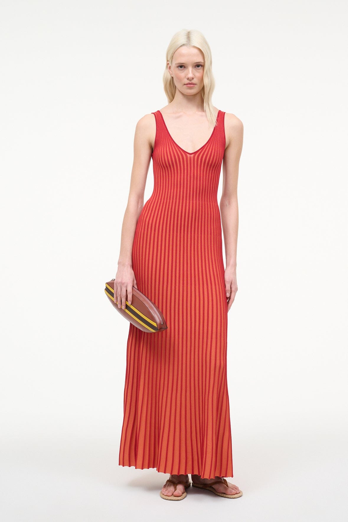 Red pleated sleeveless maxi dress with V-neck and vertical stripe pattern