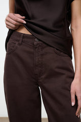 High-rise dark brown jeans with front pockets and button closure