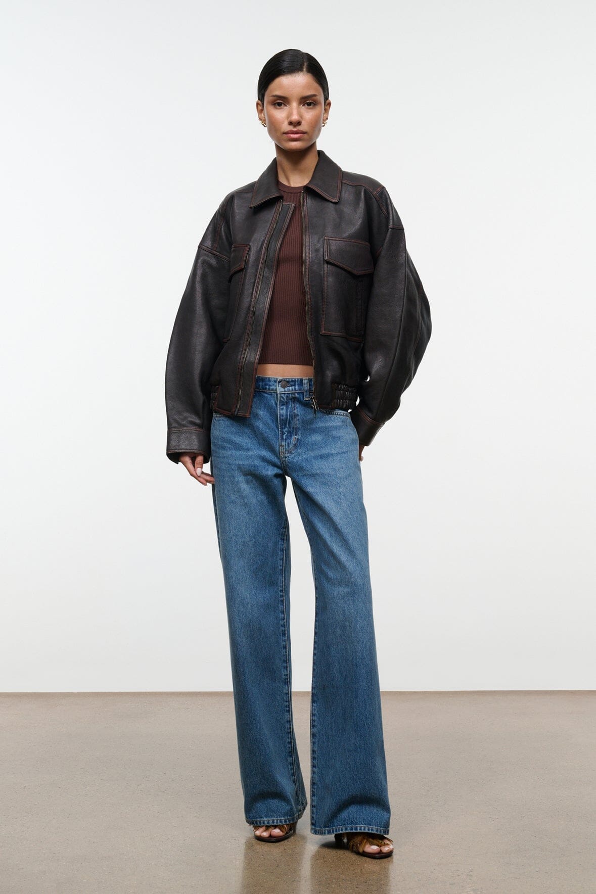 Distressed brown leather zip-up jacket with pointed collar and flap chest pockets