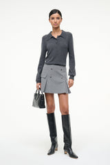 Black knee-high boots with low block heels and smooth finish