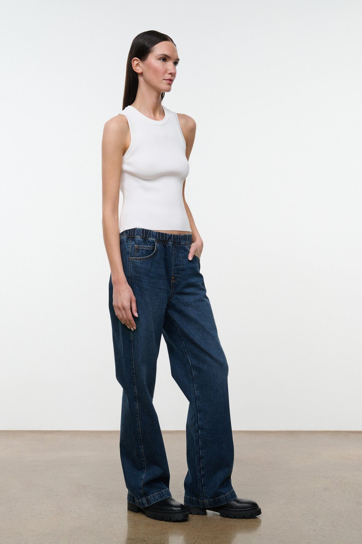 NOAH Heritage jeans dark indigo denim, high-rise wide leg, front three-quarter view
