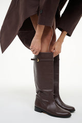 HARLOW riding boots in espresso brown worn with pants, top buckle strap detail