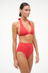 High-rise bikini bottom in red, high waist with smooth hip coverage