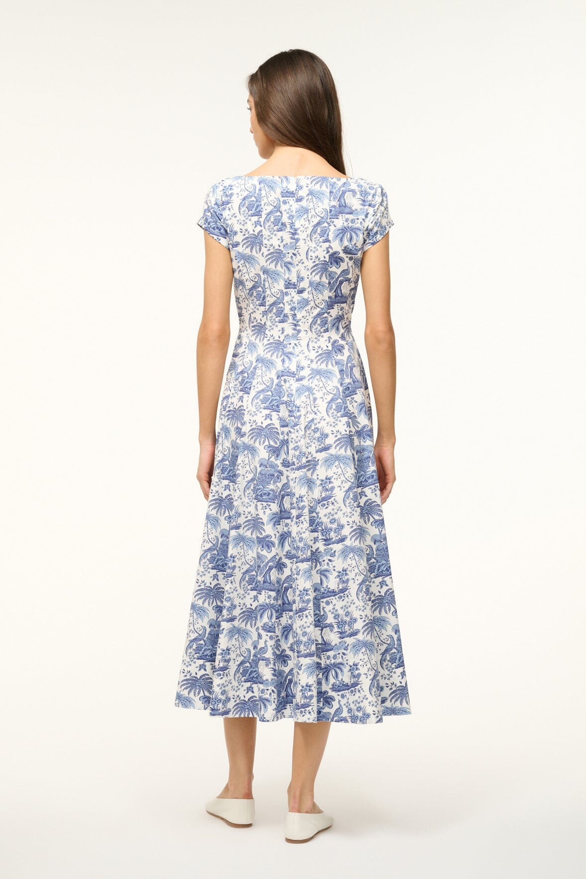 Blue toile dress back view with short cap sleeves and tiered midi hem