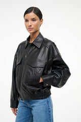 Black leather bomber jacket with stand collar, zip front, flap pockets, ribbed cuffs