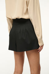 Black tailored shorts with pleated front and softly gathered waistband
