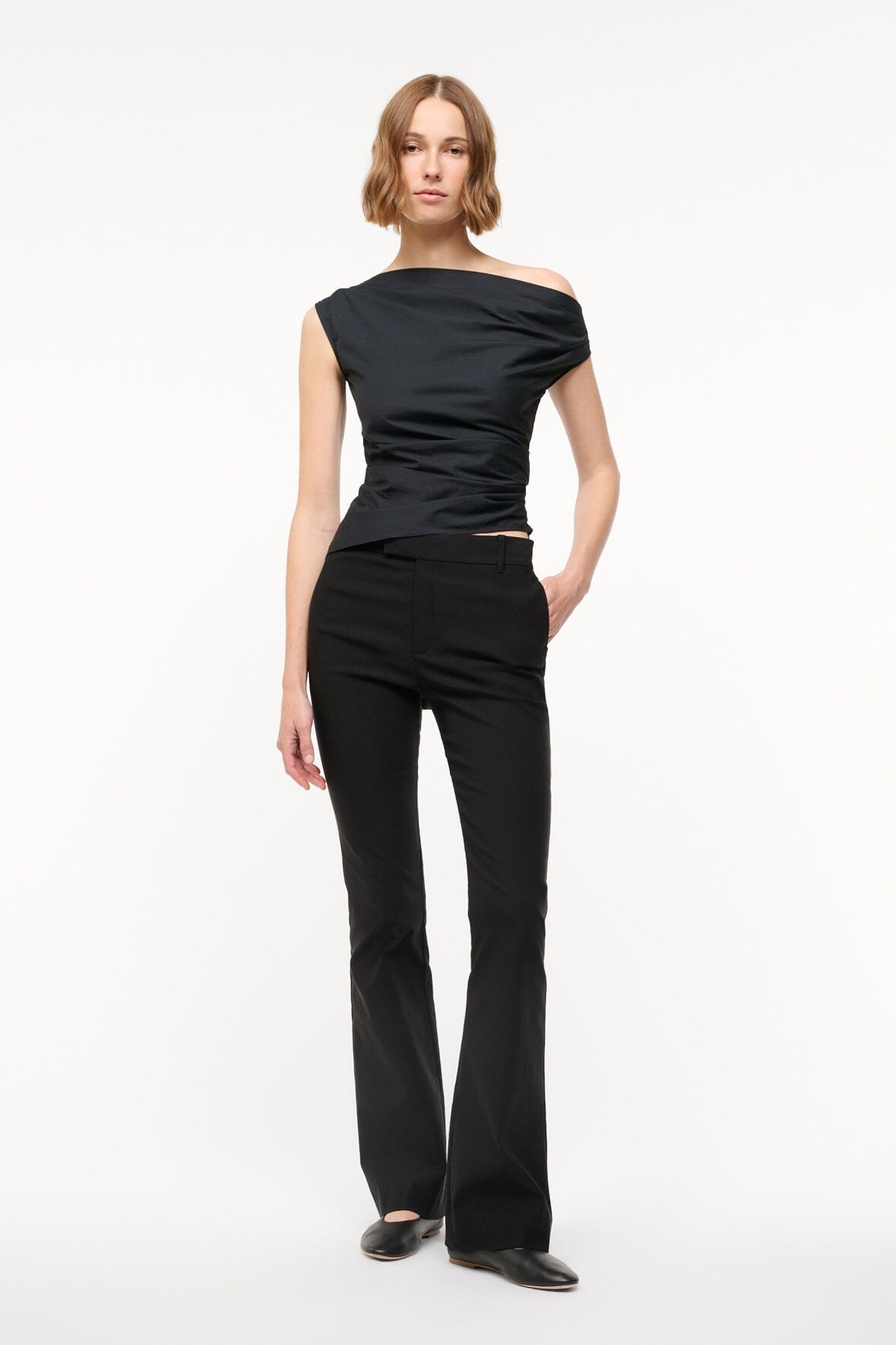 Black off-shoulder draped top with one shoulder neckline