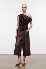 Dark brown one-shoulder silk top with diagonal drape and ruched side waist