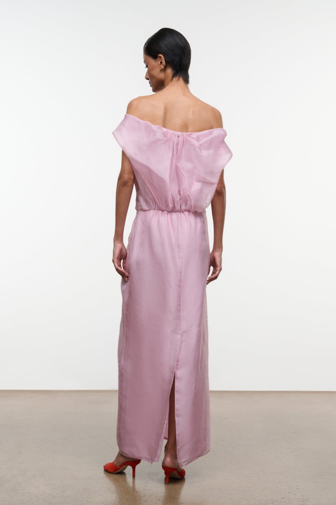 Dusty pink off-shoulder maxi dress, back view with gathered waist and back slit
