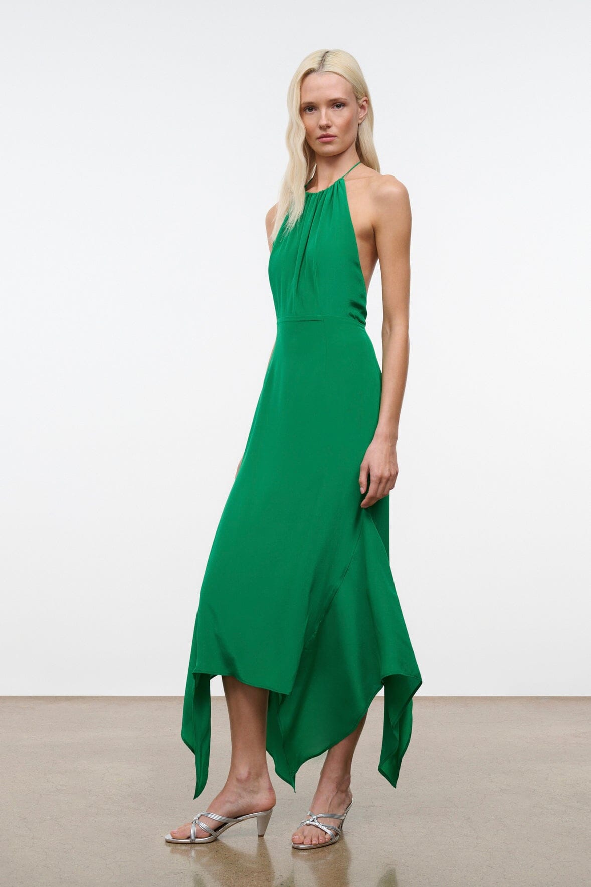 Bianca silk dress in Kelly green, halter neckline, sleeveless, side-draped midi hem
