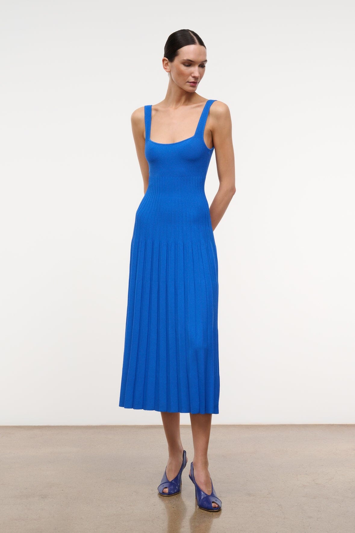 Cobalt blue sleeveless midi knit dress with square neckline and pleated hem