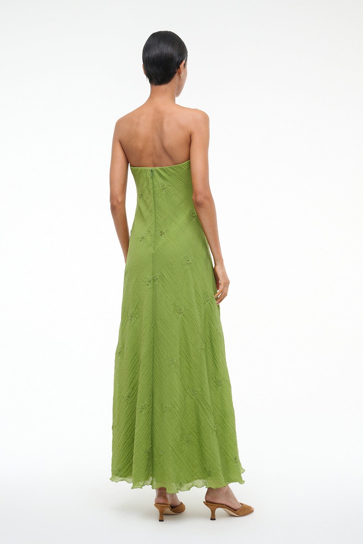 Back view of garden green strapless maxi dress in textured fabric