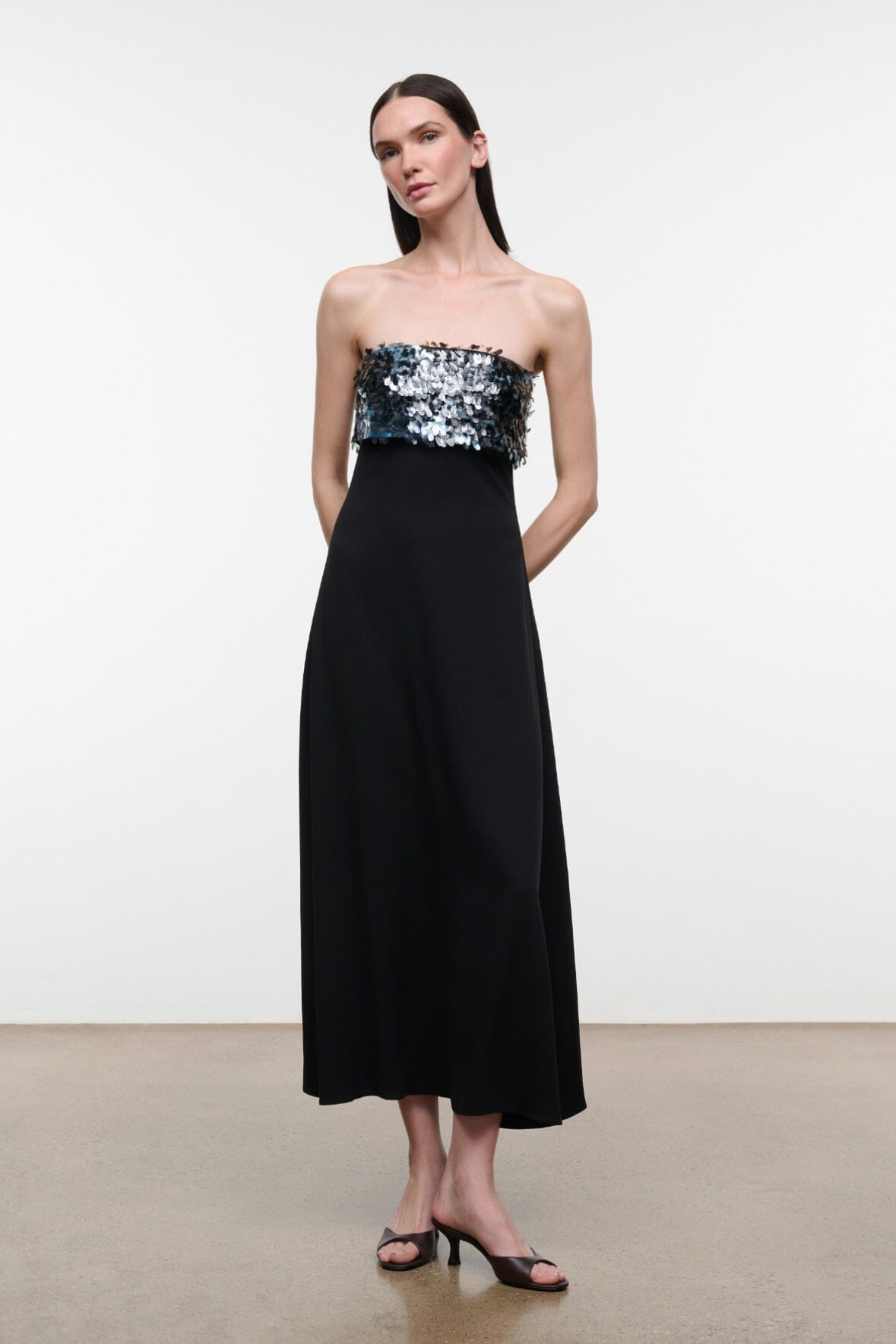 Black strapless midi dress with silver sequined bustier panel and straight skirt