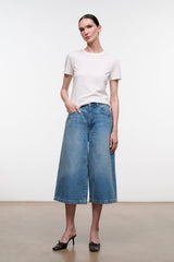 Light blue denim culotte jeans with straight wide-leg cut and center front seam